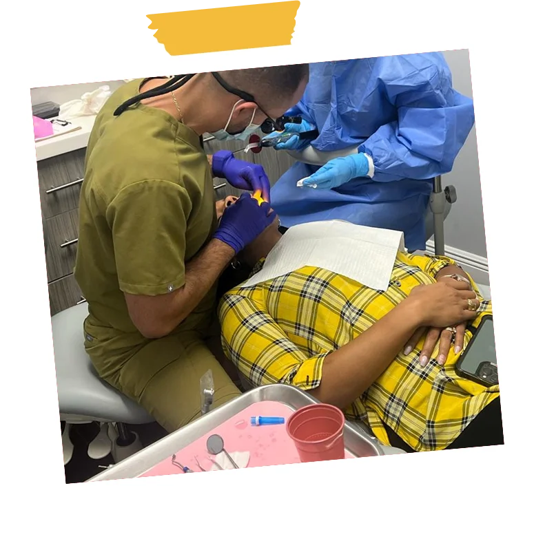 Dentists treating a patient at Sunshine Smiles Dental Clinic