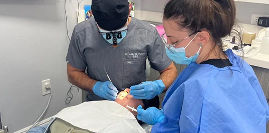 Dr. Contino placing a dental implant