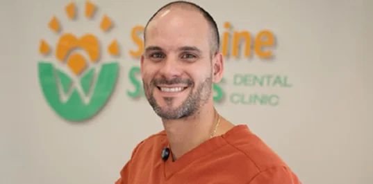 Smiling patient after clear aligner treatment
